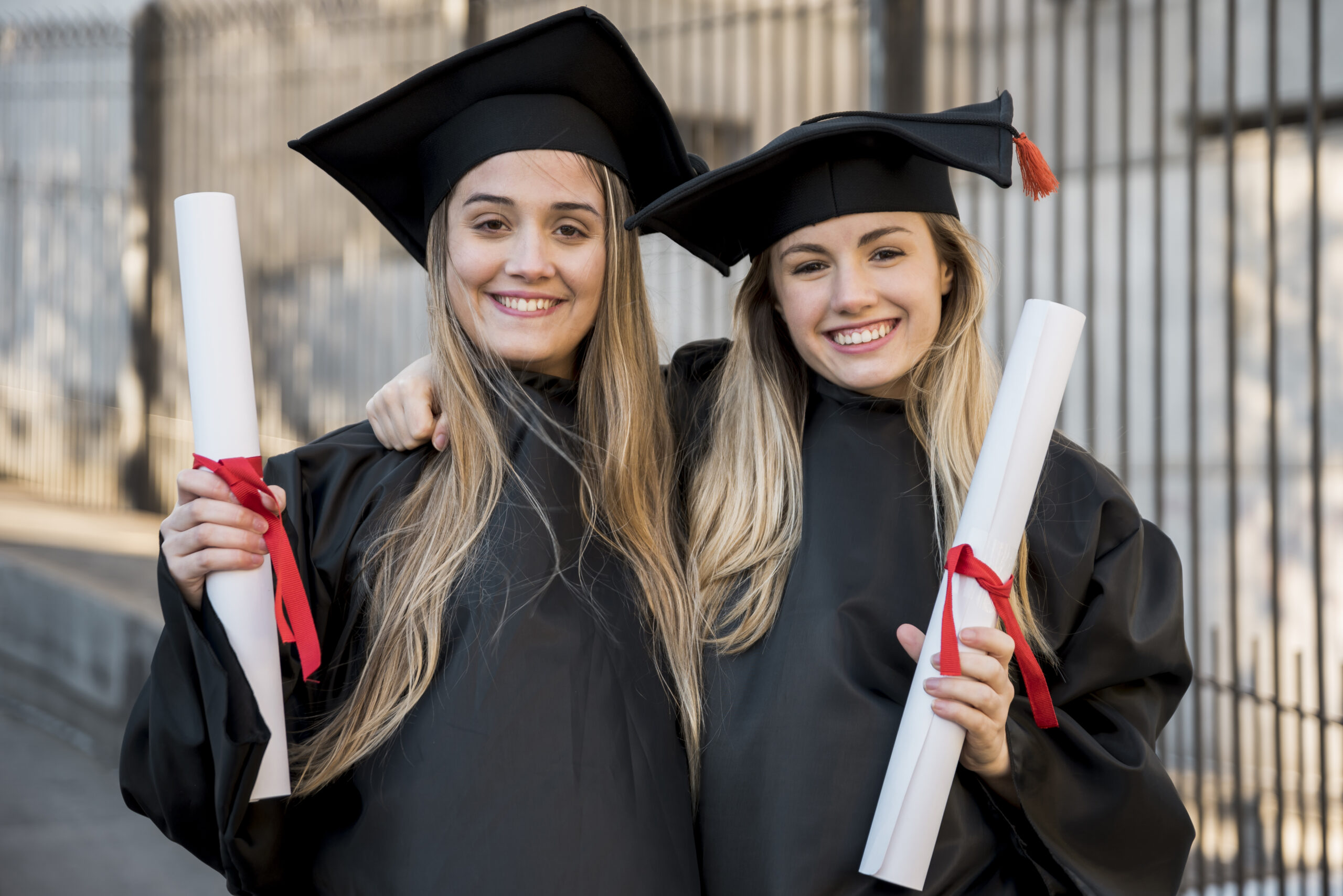 college-graduates-smiling-camera